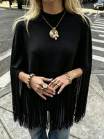Stylish, Loose-fitting Knit Cape-style Sweater With Fringe Details.