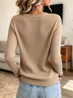 Chic Festive Knit Sweater With Sparkling Button Embellishments And A Round Neckline