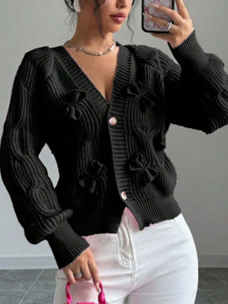 Cozy and casual cable-knit cardigan with 3D bow detail